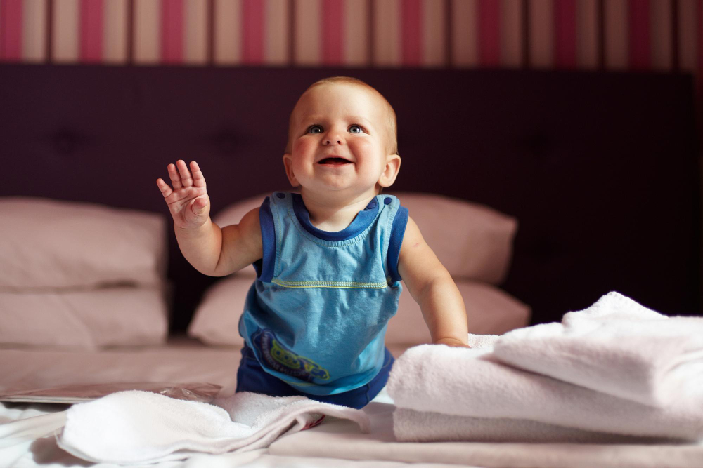 When Do Babies Start to Wave? Baby's Development Milestones