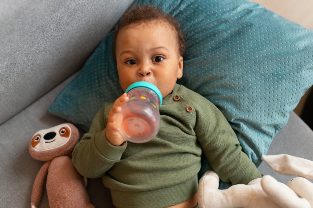 When Can Babies Hold Their Own Bottle? Self-Feed Milestones