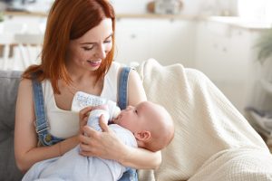 When Can Babies Hold Their Own Bottle? Self-Feed Milestones