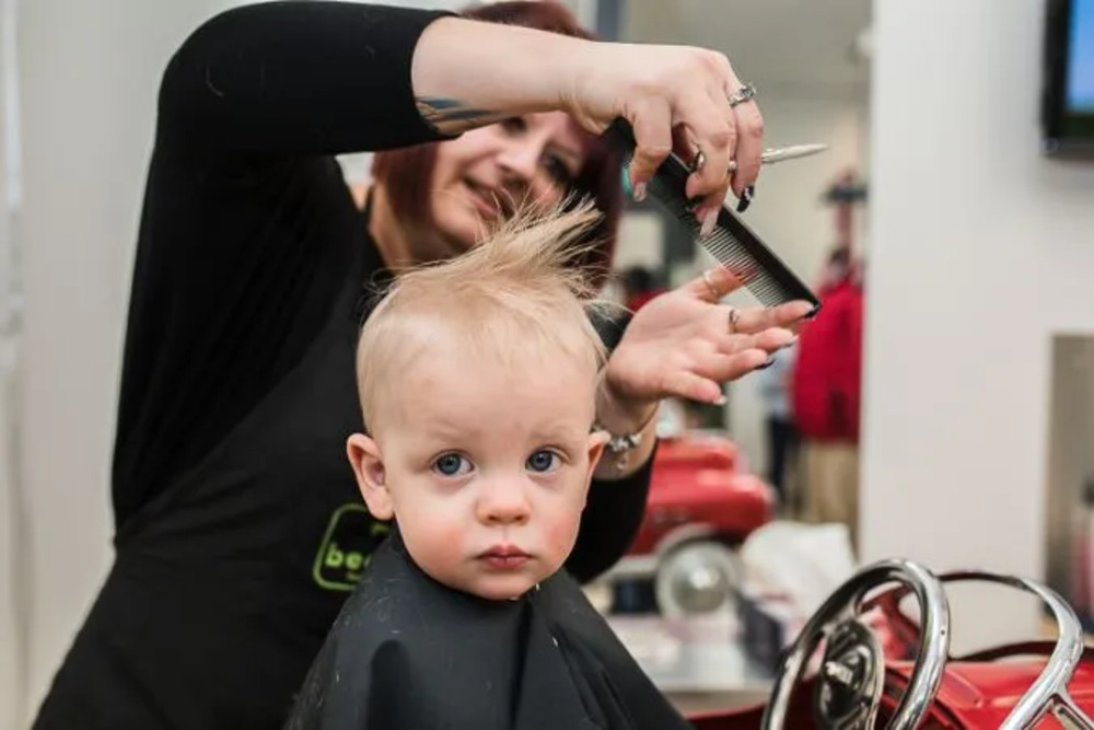 Taking baby to the salon for their first haircut